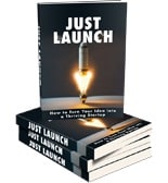 Stack of "Just Launch" books with rocket candle.