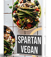 Spartan Vegan cookbook with colorful vegetable dishes on cover.